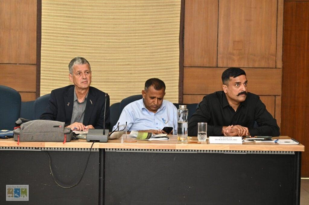 Dr Chris Bowden and Shri Anoop K.R. seated at the meeting table